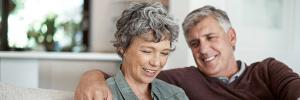 Middle aged couple researching online Middle aged couple researching online