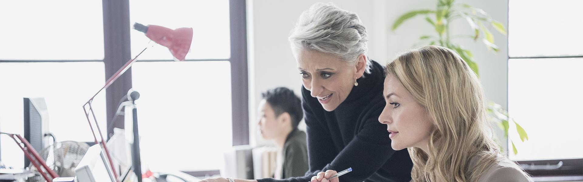 Female colleagues collaborating in the workplace 